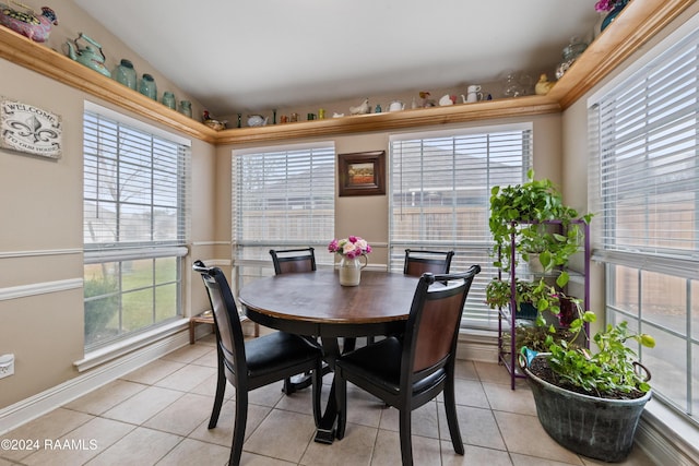 dining space with a healthy amount of sunlight and light tile patterned floors