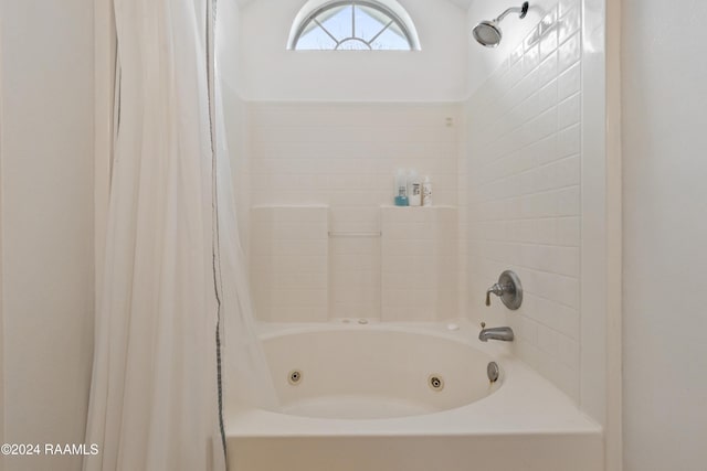 bathroom with shower / tub combo with curtain