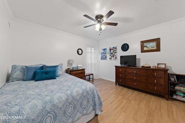 bedroom with ceiling fan, light wood-type flooring, and ornamental molding