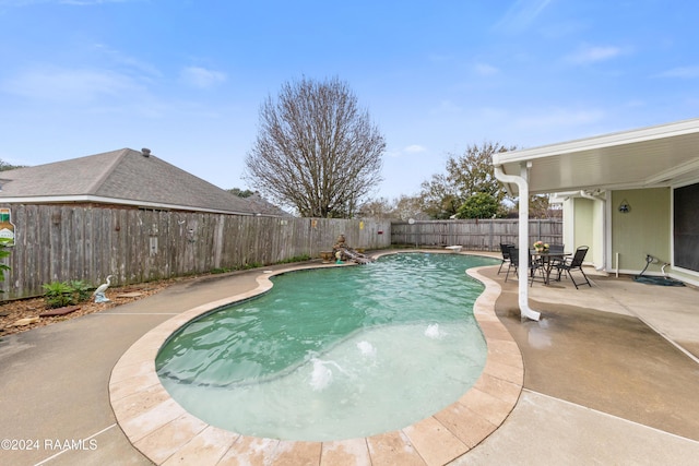 view of swimming pool with a patio area