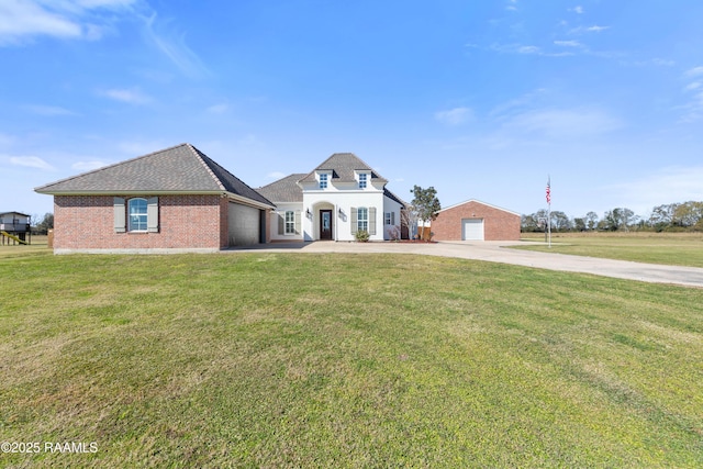 view of front of house with a garage and a front yard