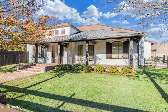 view of front of home with covered porch and a front yard