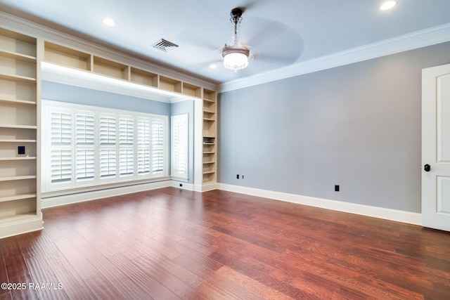 unfurnished room with hardwood / wood-style flooring, ceiling fan, built in features, and ornamental molding