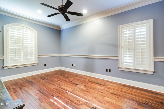 unfurnished room with hardwood / wood-style flooring, ceiling fan, and ornamental molding