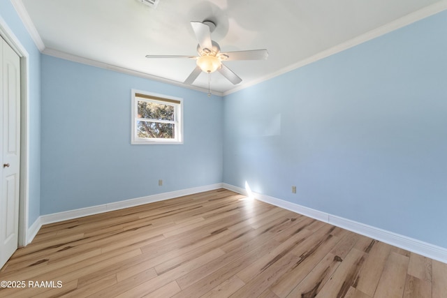 unfurnished room with light hardwood / wood-style flooring, ceiling fan, and crown molding