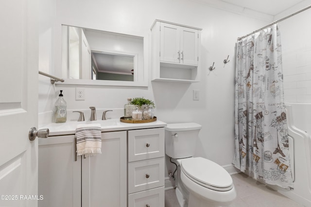 bathroom with vanity, toilet, and crown molding