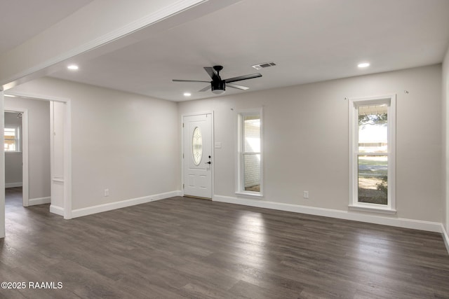 foyer entrance featuring ceiling fan and dark wood-type flooring