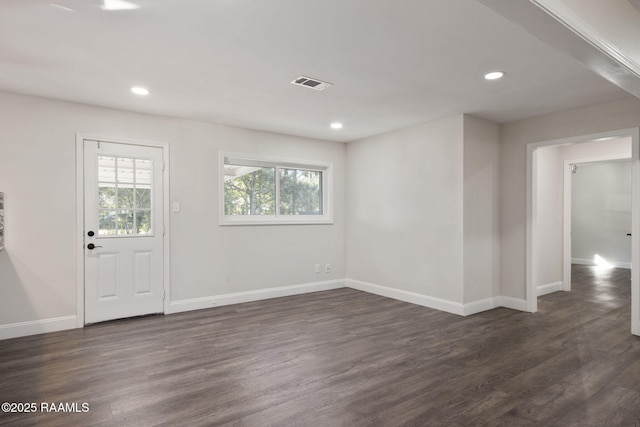 entryway with dark hardwood / wood-style floors