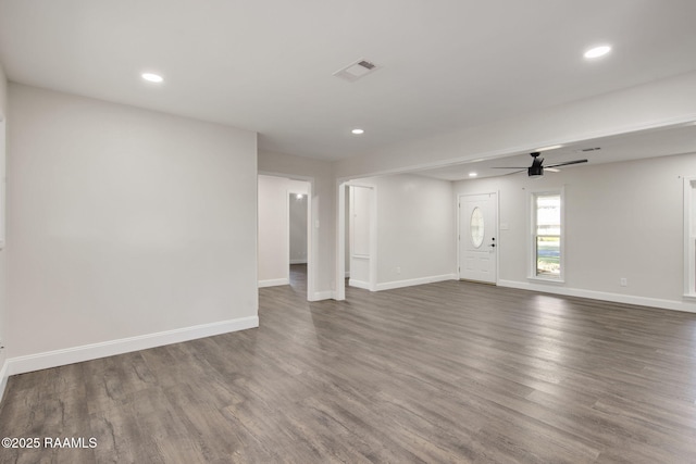 interior space with dark hardwood / wood-style floors and ceiling fan