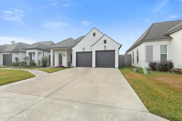 view of front of property featuring a front yard and a garage