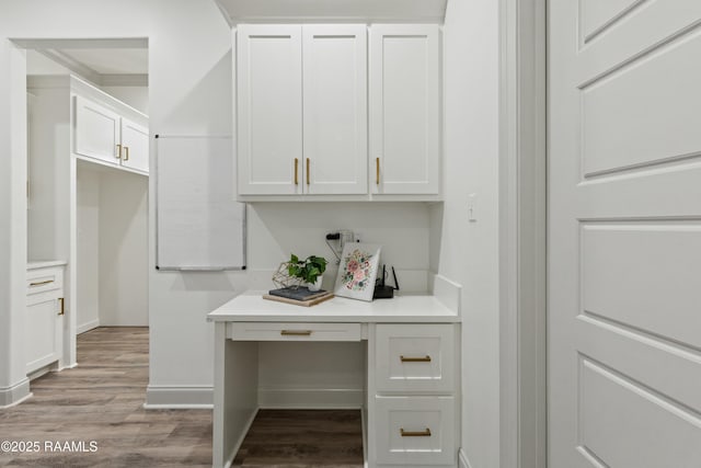 interior space featuring hardwood / wood-style floors and built in desk