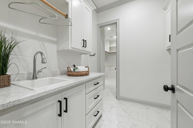 bathroom with vanity and crown molding