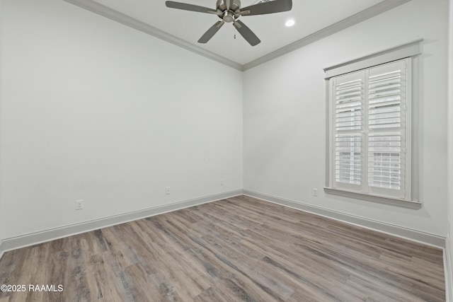 unfurnished room with hardwood / wood-style floors, ceiling fan, and crown molding