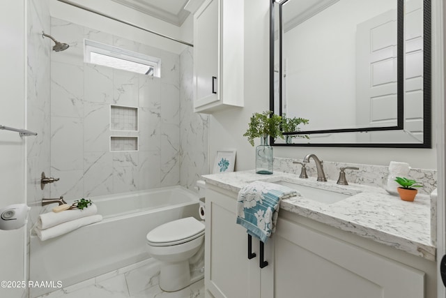 full bathroom featuring crown molding, toilet, vanity, and tiled shower / bath