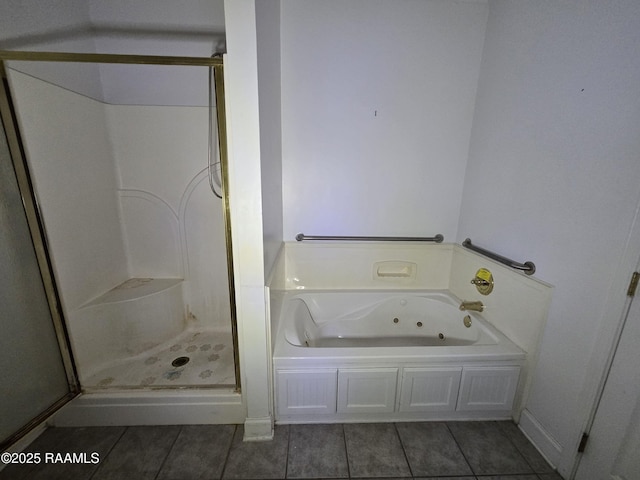 bathroom featuring tile patterned flooring and shower with separate bathtub