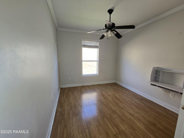 empty room featuring hardwood / wood-style floors, ceiling fan, and crown molding