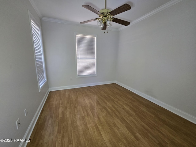 spare room with dark wood-type flooring, ceiling fan, and ornamental molding