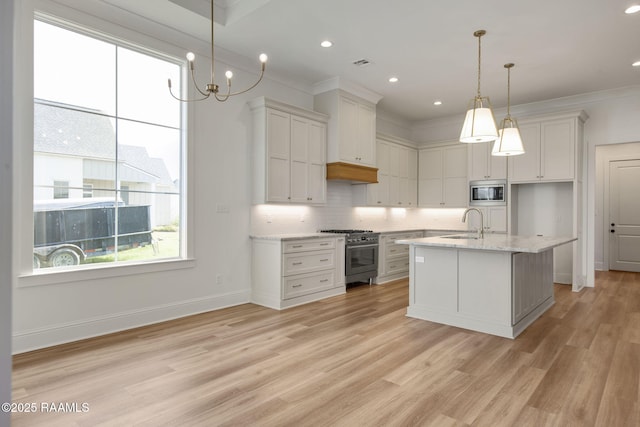 kitchen with white cabinetry, sink, and appliances with stainless steel finishes