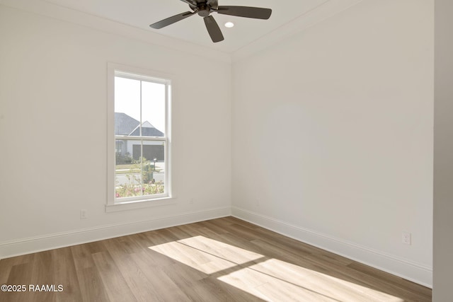 unfurnished room featuring crown molding, ceiling fan, and light hardwood / wood-style floors