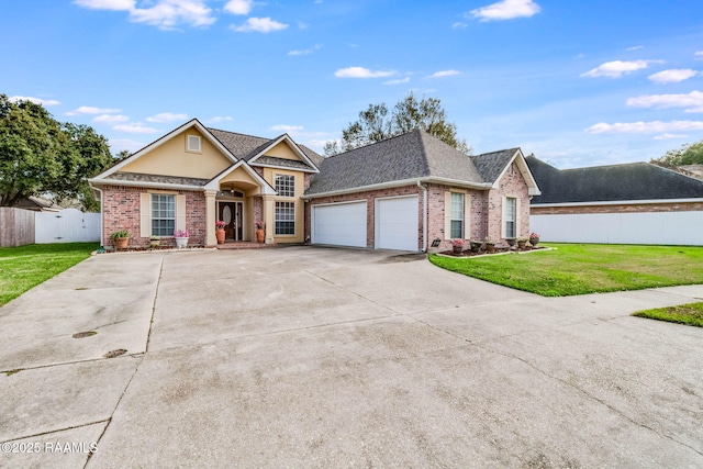 view of front of home featuring a garage and a front lawn