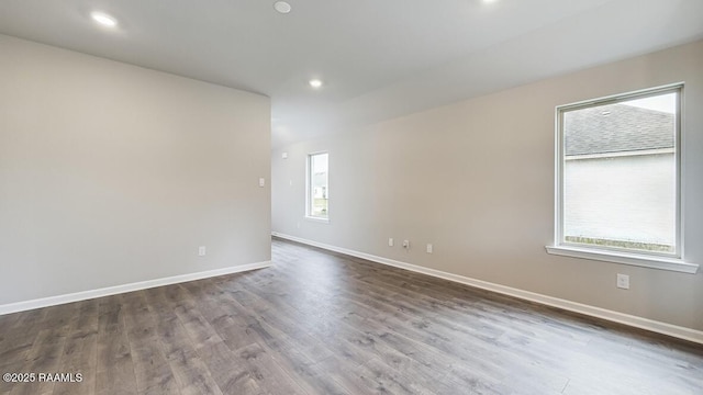 empty room with dark hardwood / wood-style floors