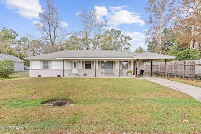 single story home featuring a carport, a porch, and a front yard