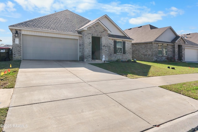 view of front facade with a front yard and a garage