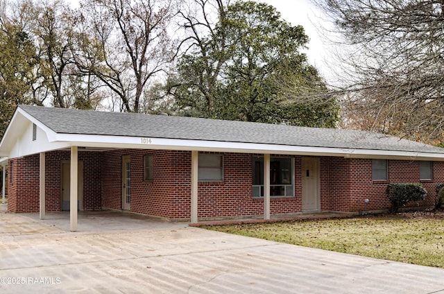 ranch-style house featuring a carport