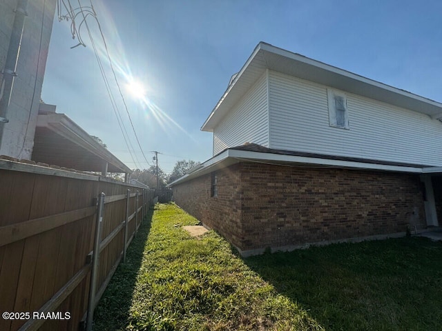 view of property exterior featuring a yard