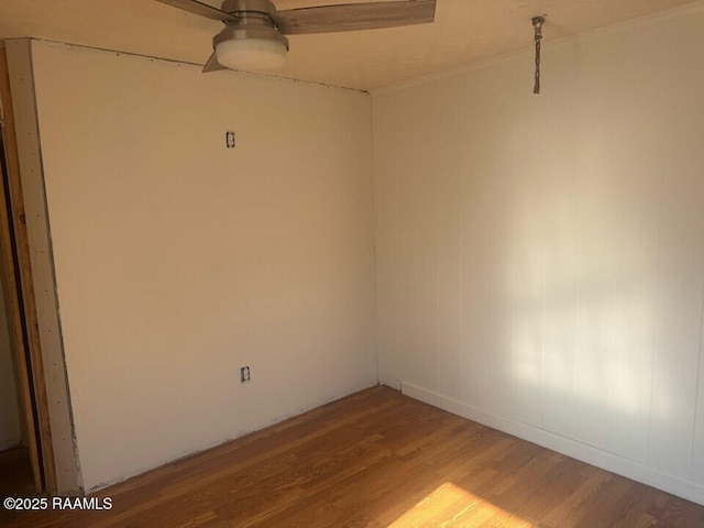 spare room with hardwood / wood-style floors and ceiling fan