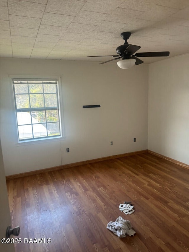 unfurnished room featuring hardwood / wood-style flooring and ceiling fan