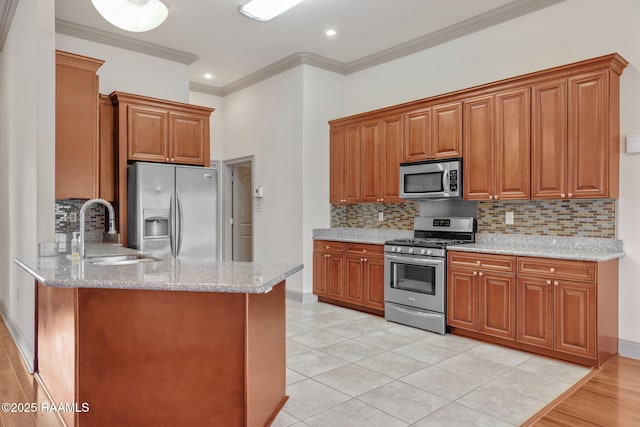 315 Begnaud Dr, Lafayette, LA 70501 - kitchen with sink, stainless steel appliances, and light stone counters