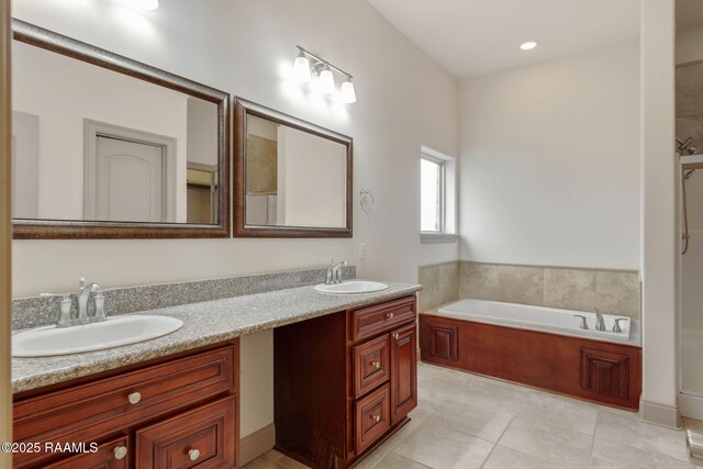 315 Begnaud Dr, Lafayette, LA 70501 - bathroom with vanity, tile patterned floors, and a bathing tub