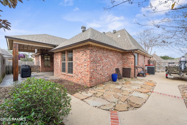 view of home's exterior with a patio and central air condition unit