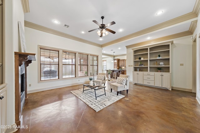 living room with dark tile patterned floors, built in features, ceiling fan, and ornamental molding