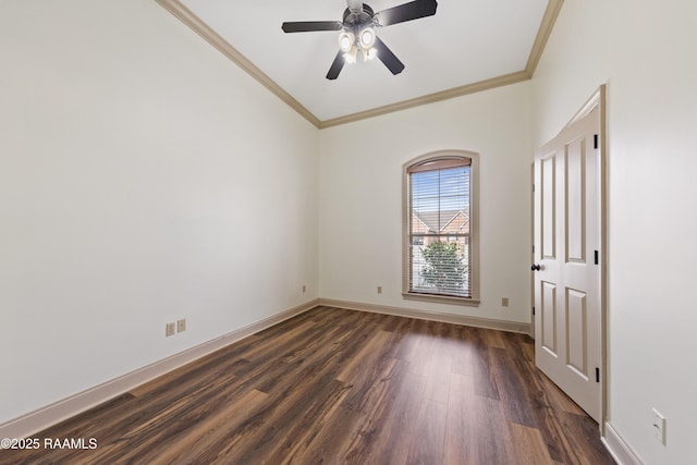 unfurnished room with crown molding, ceiling fan, and dark wood-type flooring