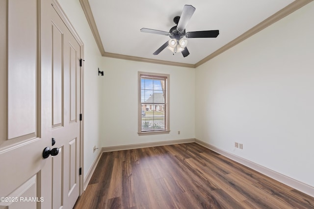 spare room featuring ceiling fan, dark hardwood / wood-style floors, and ornamental molding