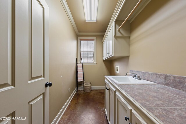 laundry room with sink, cabinets, crown molding, and hookup for a washing machine