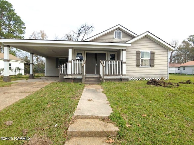 view of front of house with a front lawn and a carport