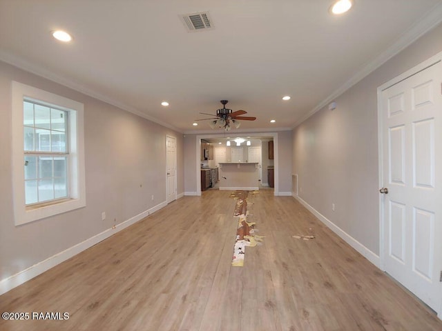 unfurnished living room with ceiling fan, light wood-type flooring, and ornamental molding