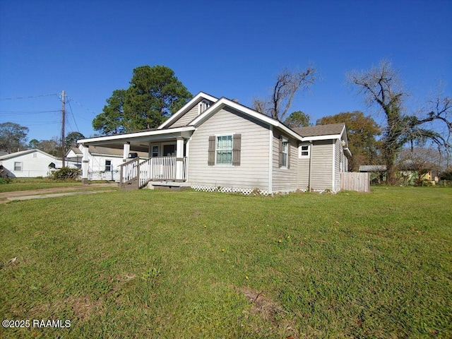 view of front of home with a porch and a front lawn