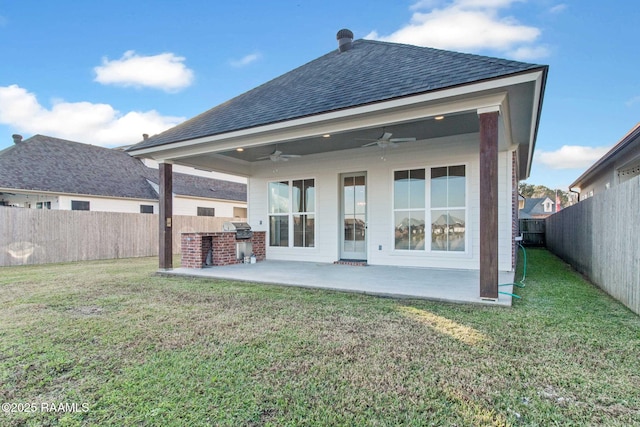 back of house featuring a patio, ceiling fan, and a lawn