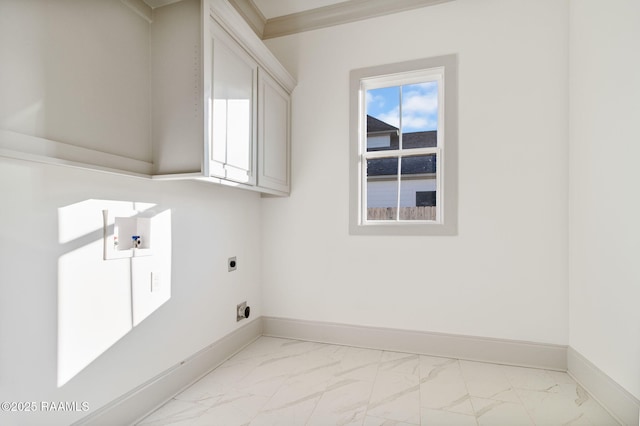 washroom with crown molding, cabinets, and hookup for an electric dryer