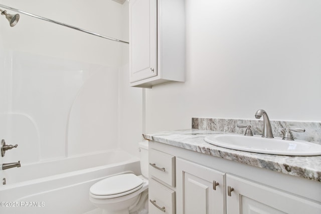 full bathroom featuring vanity, shower / bath combination, and toilet