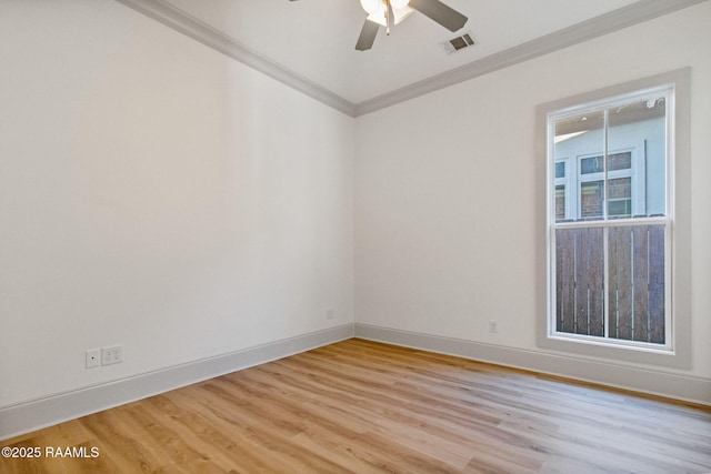 spare room featuring ceiling fan, crown molding, and light hardwood / wood-style flooring