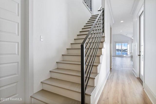 stairway featuring wood-type flooring