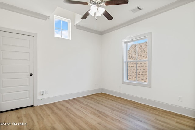 empty room featuring ceiling fan, light hardwood / wood-style flooring, and ornamental molding