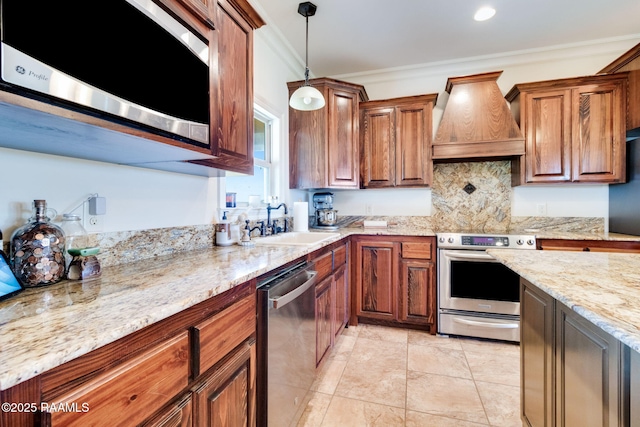 kitchen featuring crown molding, sink, hanging light fixtures, custom range hood, and stainless steel appliances