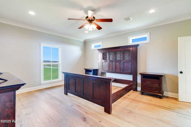 bedroom featuring light hardwood / wood-style flooring, ceiling fan, and ornamental molding