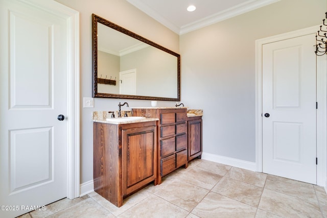 bathroom with crown molding, tile patterned flooring, and vanity